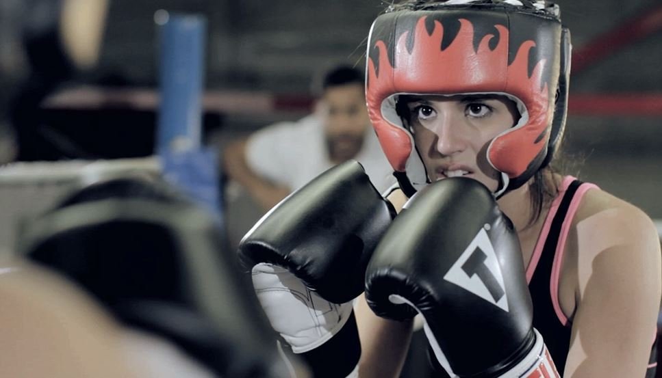 Athena (Jenna Kenall) in a sparring match.