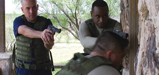 Still of Edward Williams and Wesley Kimenyi on the set of Drift.