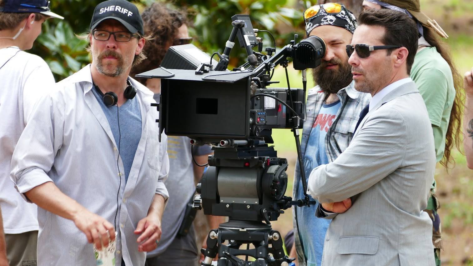 Director Miles Doleac (left) sets up a shot with Camera Operator, Derek Fisher (center), and James Callis (right).