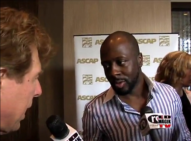Rapper, singer, record producer and politician Wyclef Jean and Pete Allman