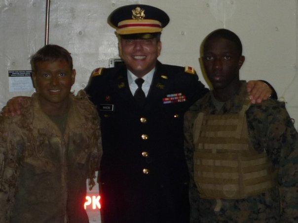 John Mancini as himself as an Army 1LT flanked by two Marines.