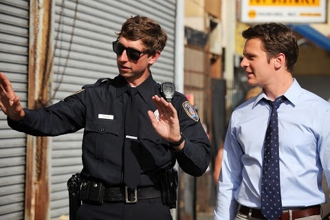 Jacob R. Burke and Jonathan Groff on the set of 