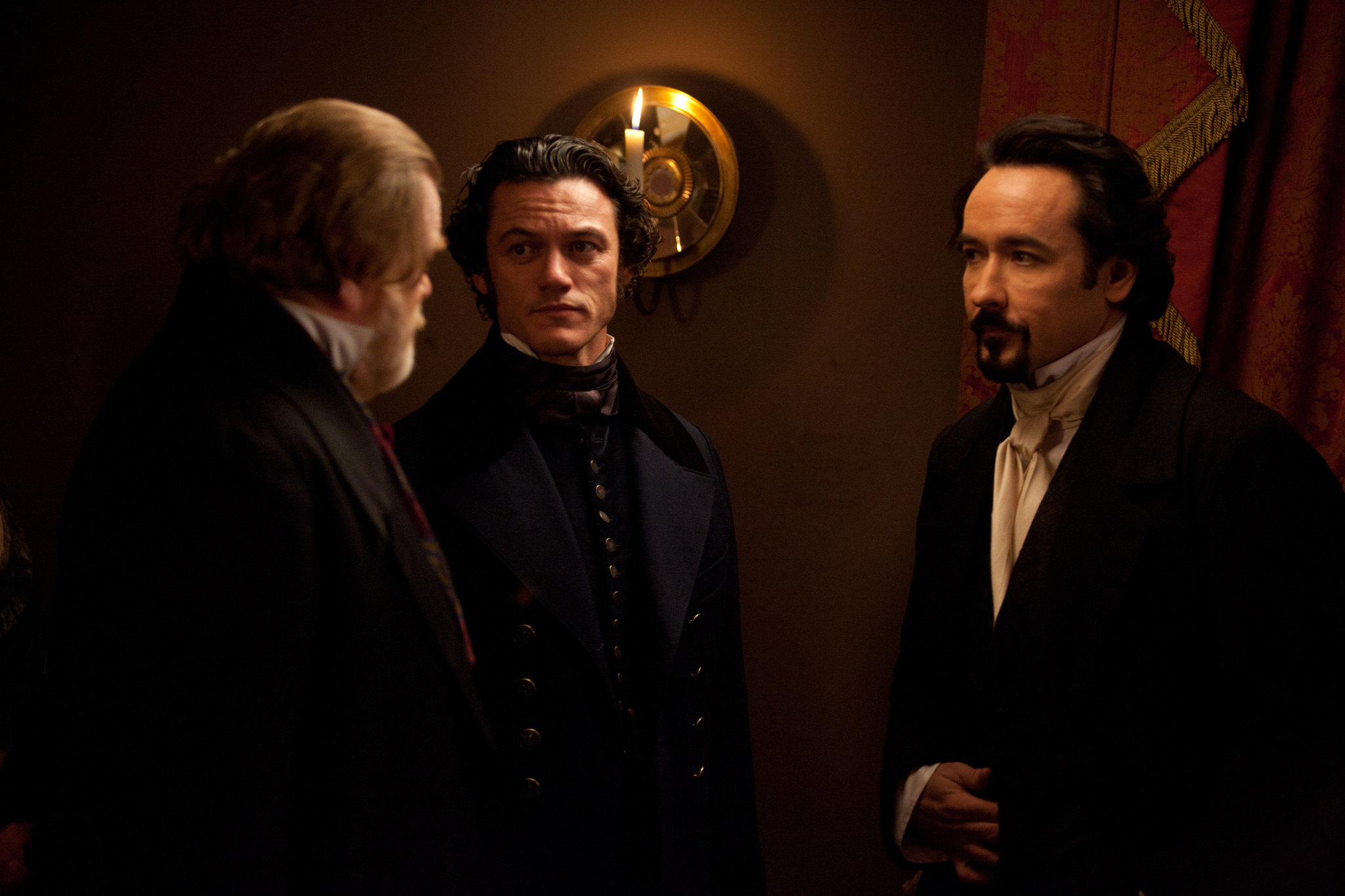 Still of John Cusack, Brendan Gleeson and Luke Evans in Varnas (2012)