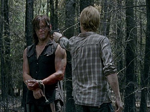 Still of Norman Reedus and Austin Amelio in Vaiksciojantys negyveliai (2010)