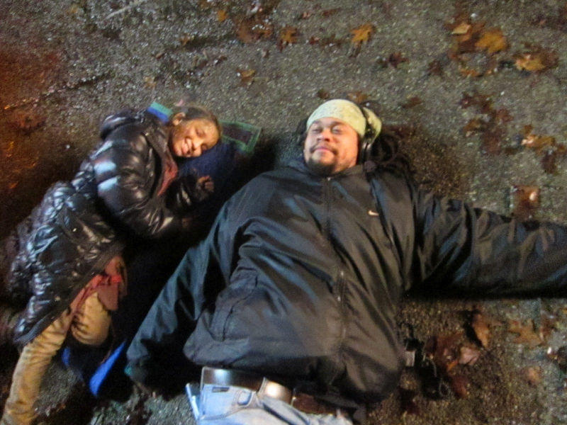 Director Seith Mann Joins Olivia Steele Falconer on the ground before shooting a scene. Falling Skies, Death March