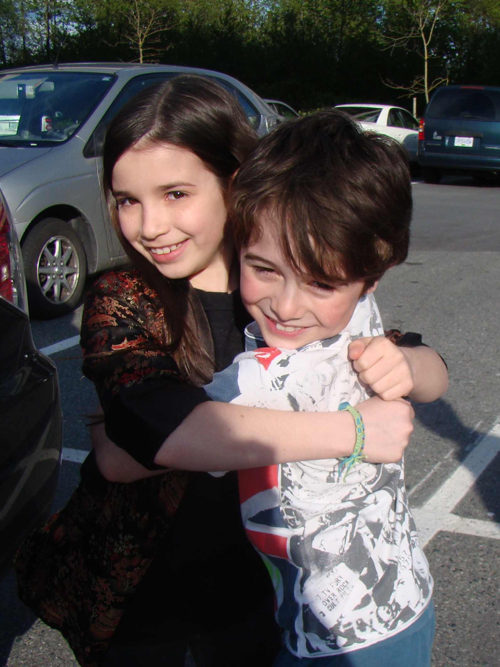 Olivia Steele-Falconer & Valin Shinyei big hugs on set of 