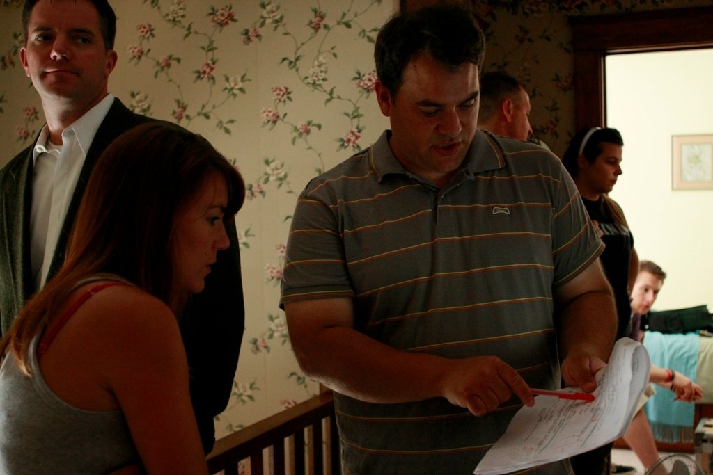 Jerry LaBuy discusses a scene with actress Katrina Kuntz and actor Jeff Diebold.