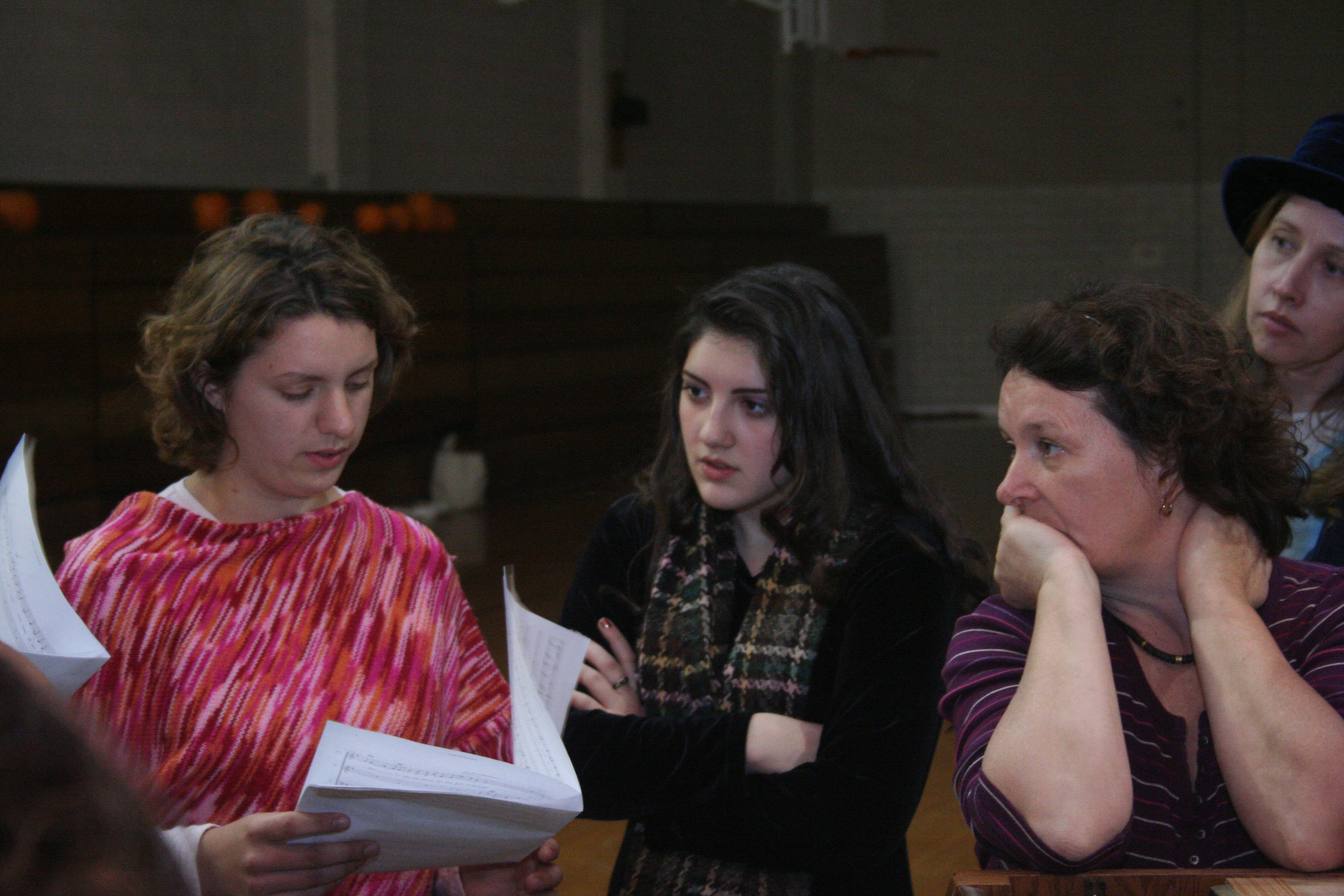 Mary Rose Maher with actresses Karina Bihar, Susanna Bihar and Carrie Kot going over the sheet music for the musical McGivney!