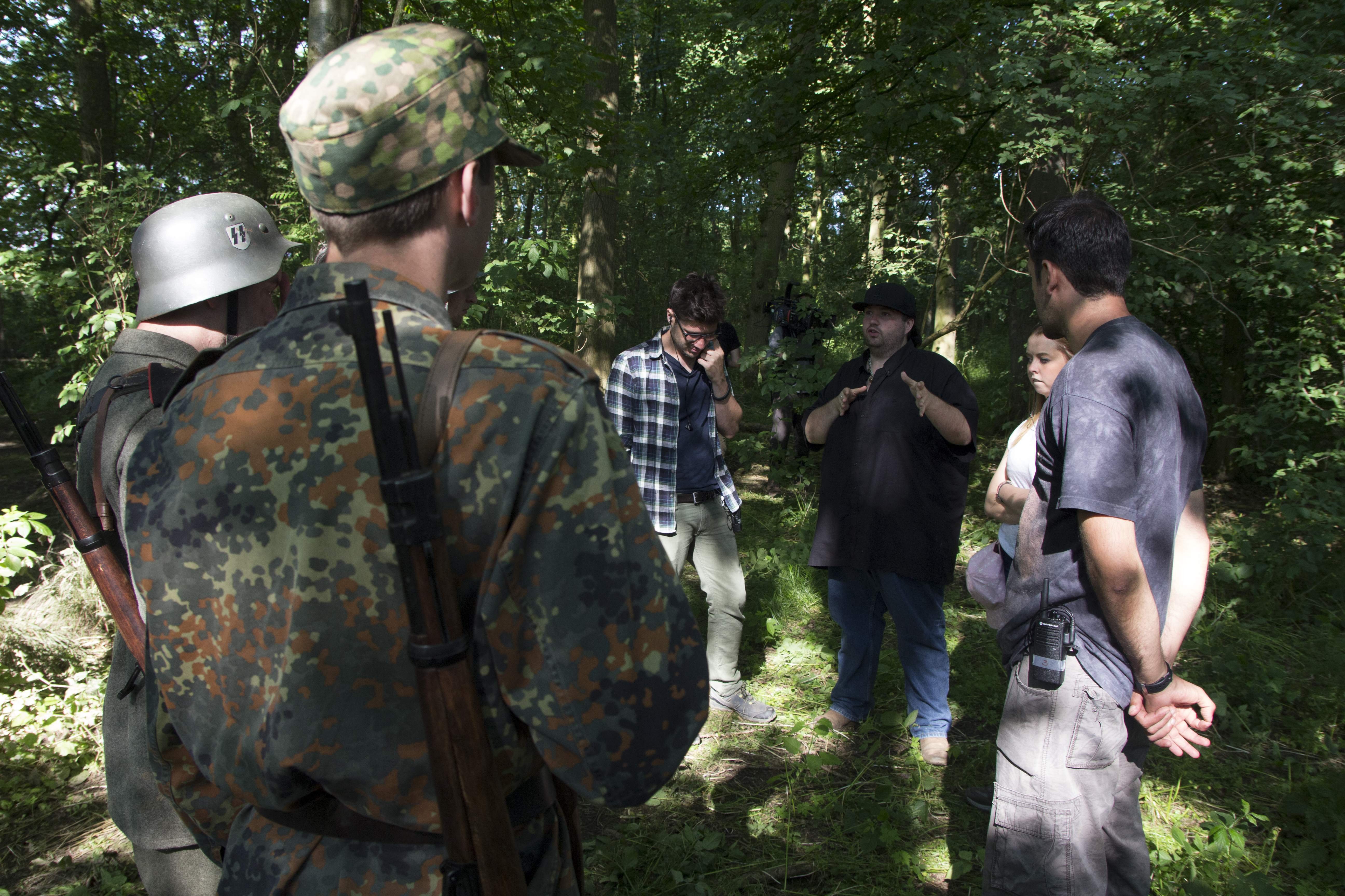 Director Dominic Burns marshals the troops.