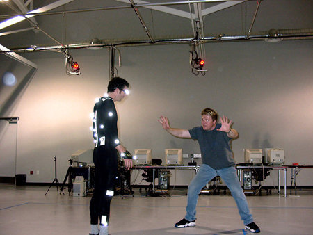 Scott Duthie discusses virtual camera angles and movement as he prepares a motion capture performer for the scene.