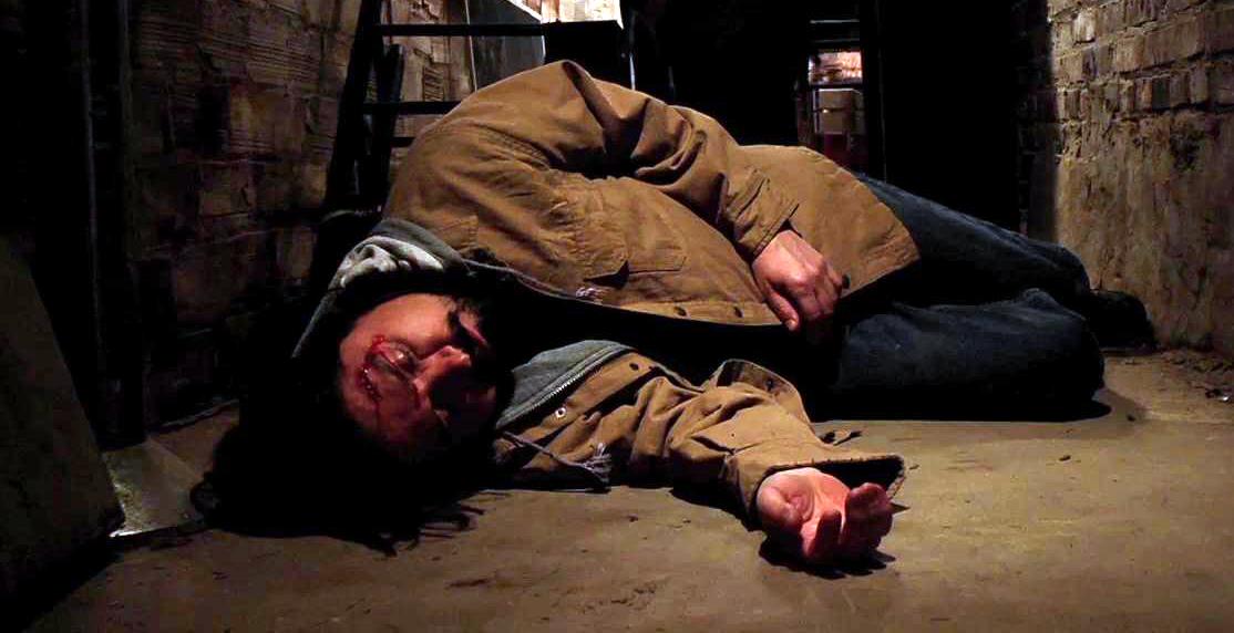 Man laying unconscious after Jimmy hit him in the head in The Basement
