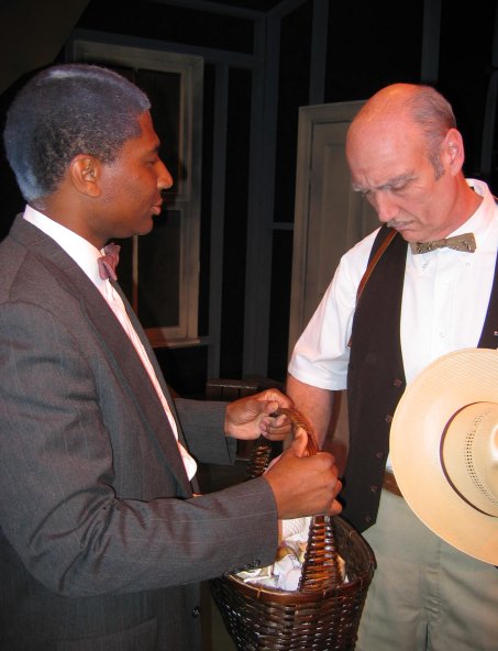 Performance still of The Sheriff and Professor Wiggins in a intense time of fellowship in 
