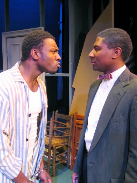 Performance still of Jefferson and Professor Wiggins face-off in 