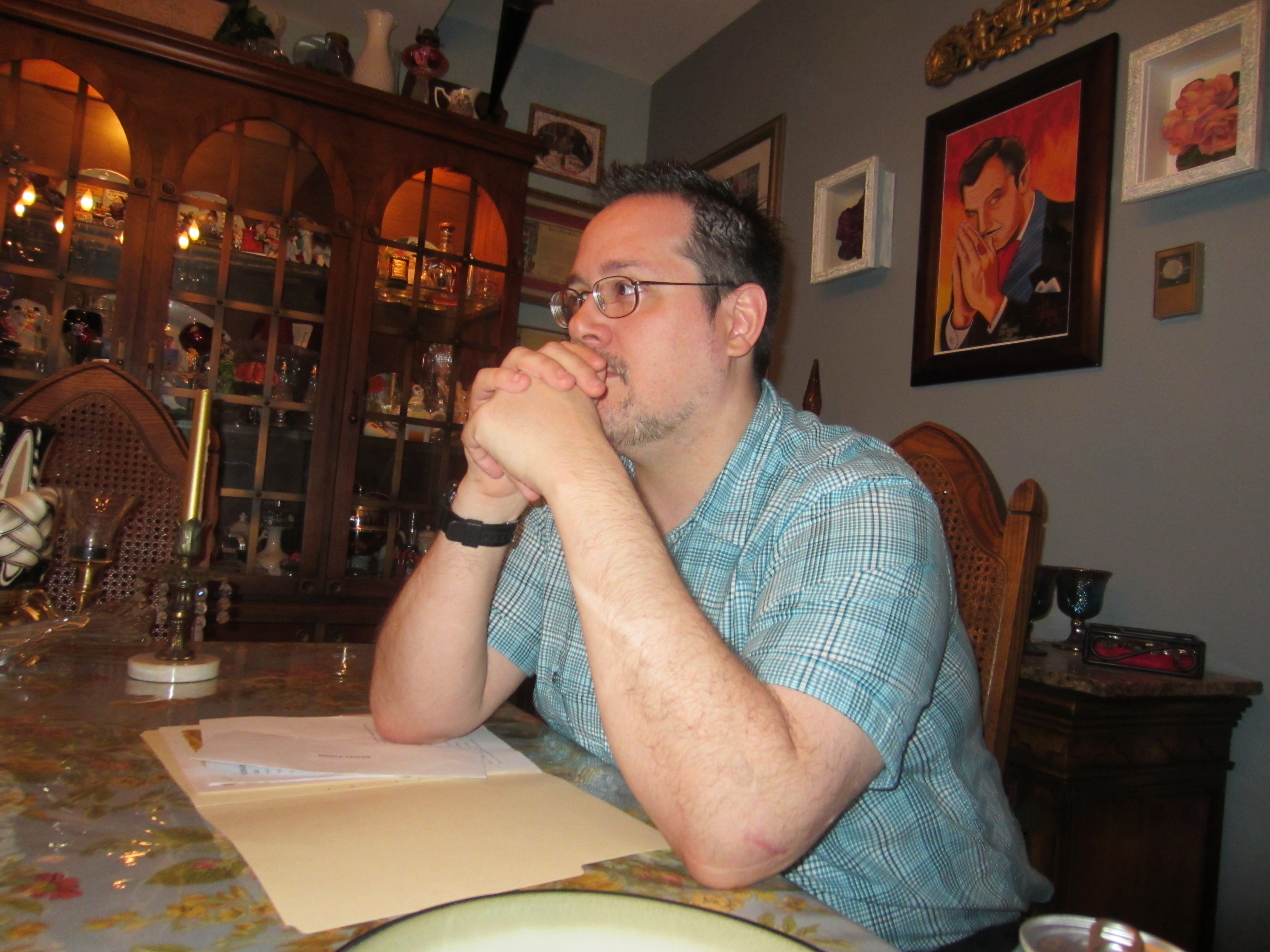 Taken at a brainstorming session where Glen was completely unaware of the painting of Vincent Price hanging behind him.