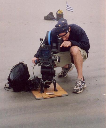 On location, director Denis Adam Zervos filming commercial for the Olympics on Santorini, Greece.