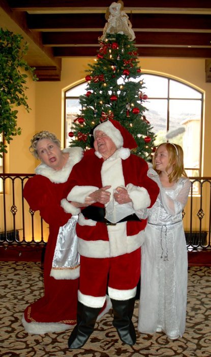 Megan Ashley as Lily, with Santa (Mickey Rooney) and Mrs. Clause (Jan Rooney) from the film 