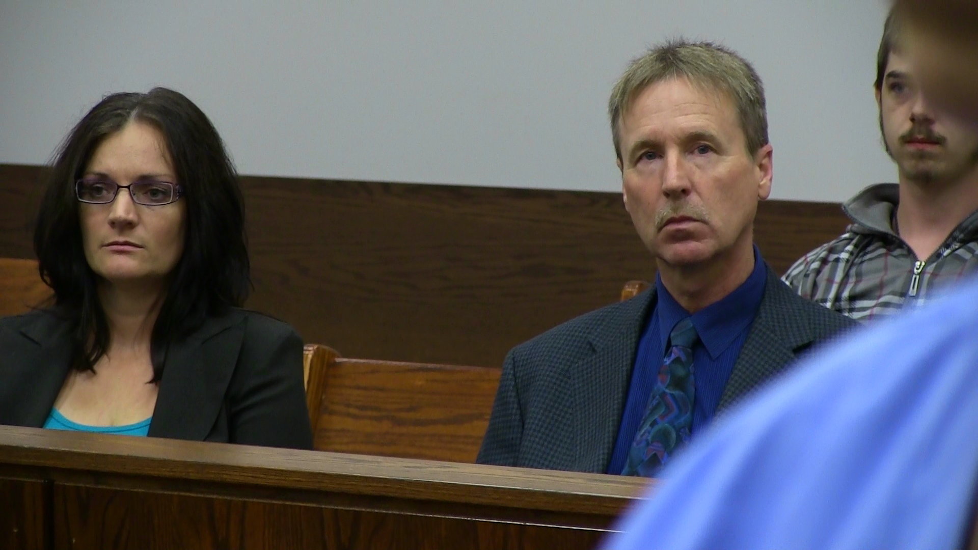 Ashley's parents look on as she appears in court during a scene from Daughter of the King.