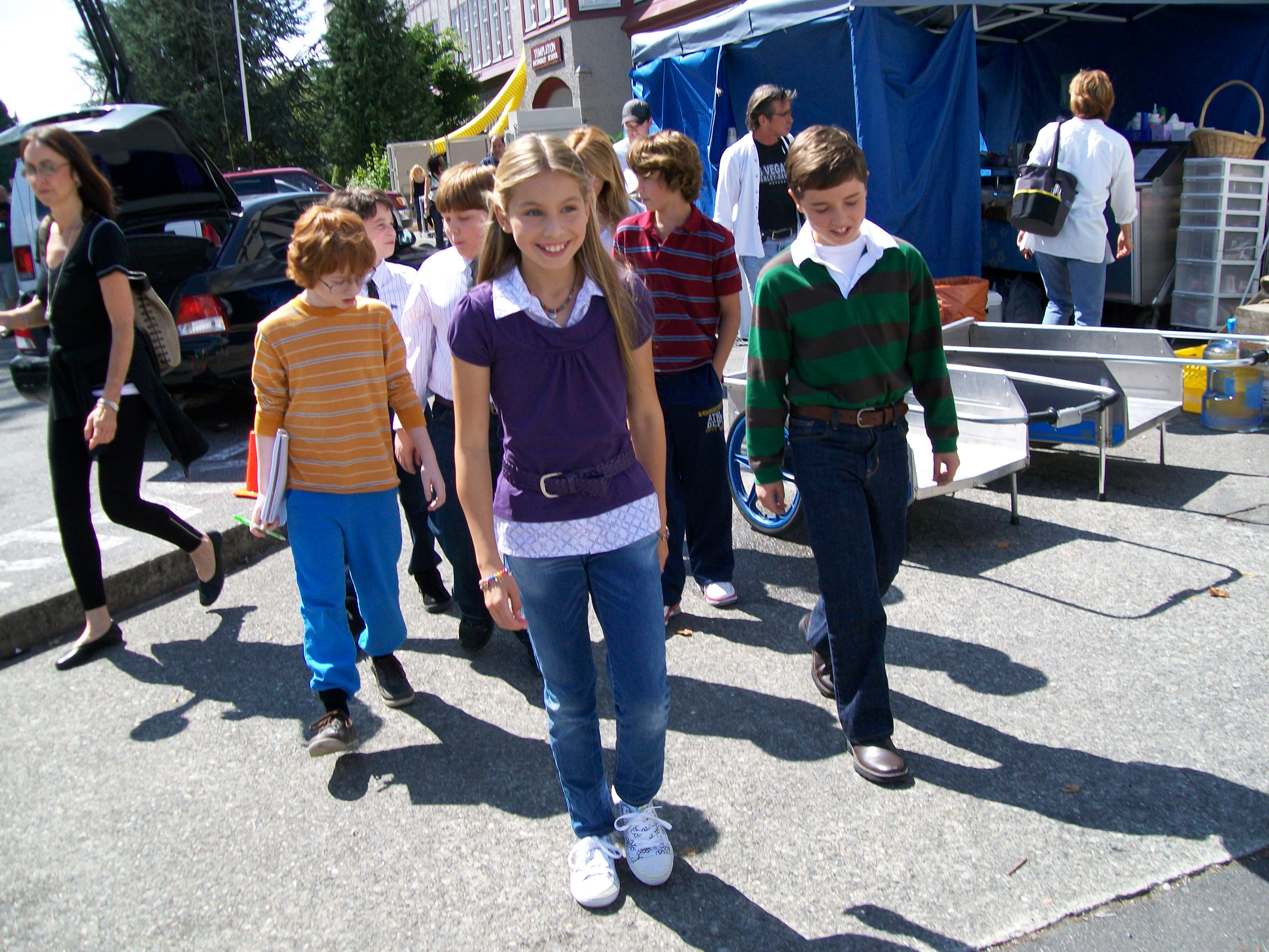 Zachary Gordon who plays Greg, Robert Capron who plays Rowley and other cast on set from the Diary of a Wimpy Kid film production are being led by Samantha Page from Vancouver, Canada who plays the outgoing popular Shelley.