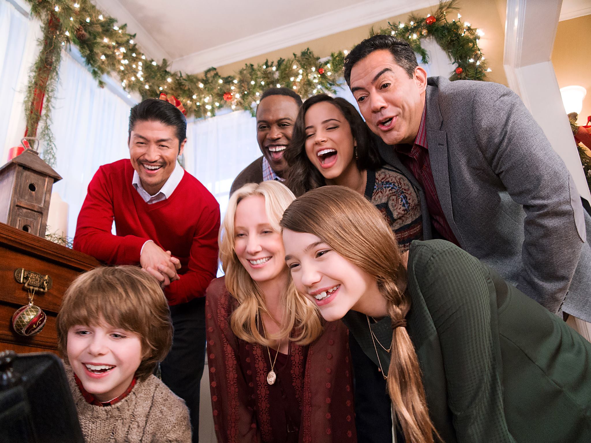 Griffin Kane with Anne Heche, Alissa Skovbye, Brian Tee, Kevin Daniels, Kiara Madiera, and Carlos Gomez on the set of One Christmas Eve, 2014.