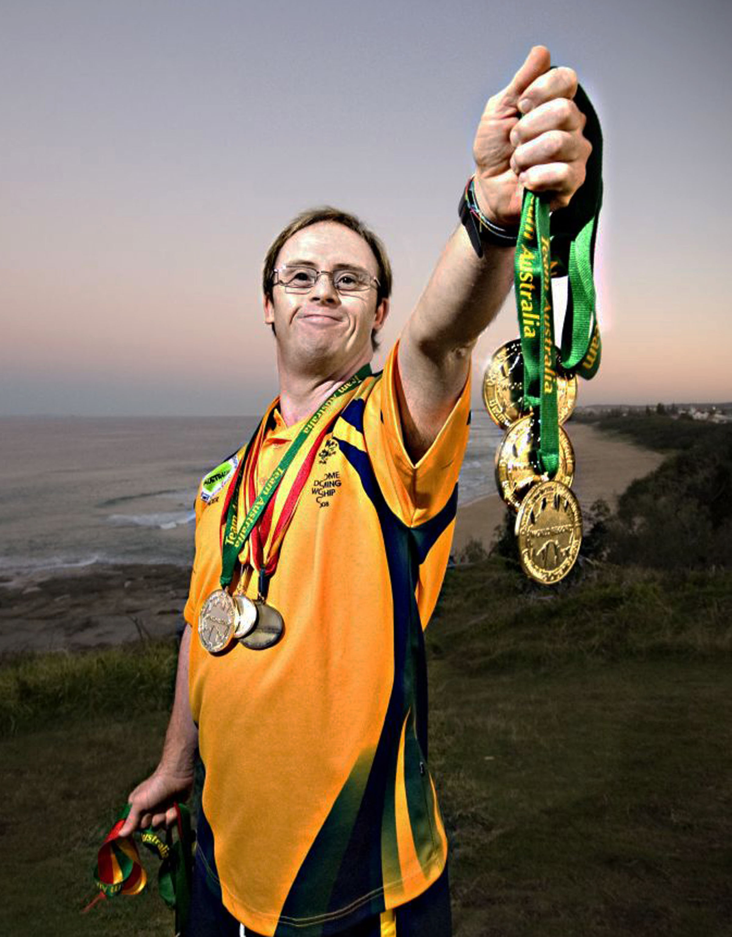 Ty Belnap with some of his medals, won swimming for Australia. Ty stars in Just Like U.