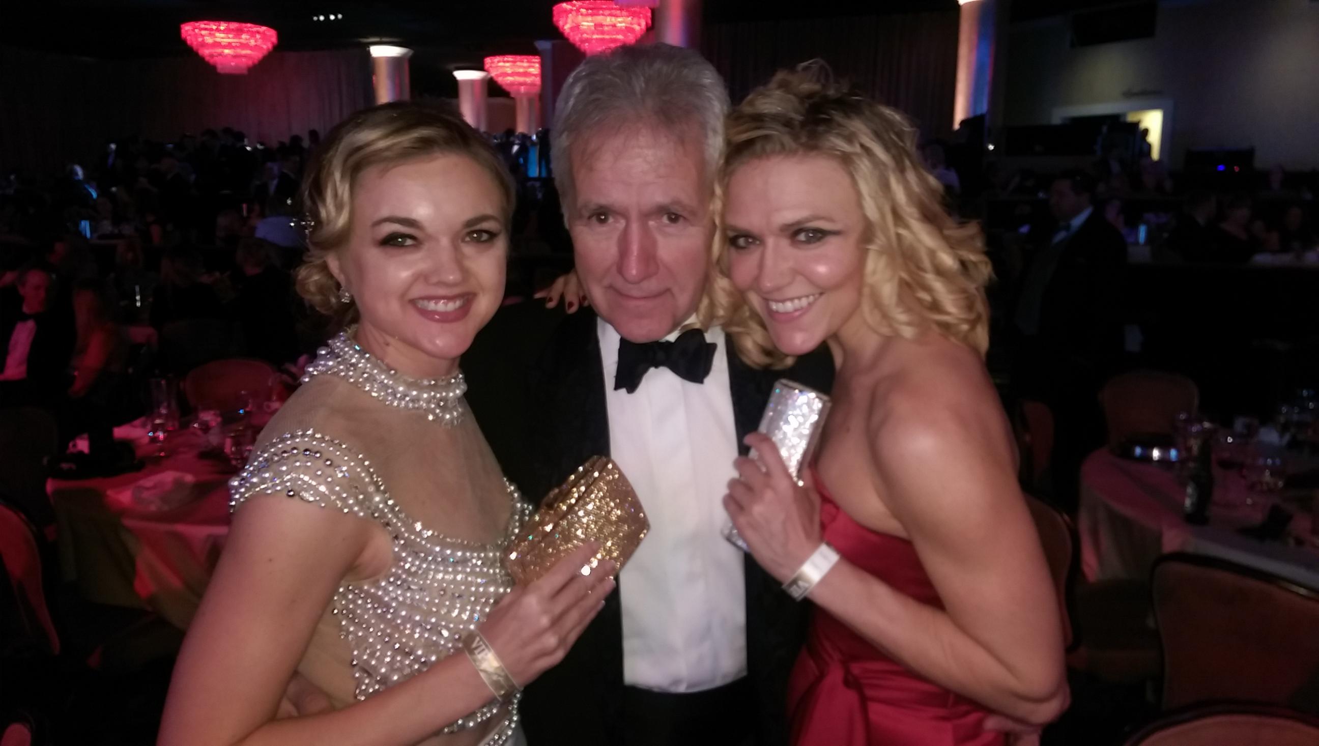 Director Gina Lee Ronhovde, Alex Trebek, and Dominique Swain attend the 25th Annual Night of 100 Stars at the Beverly Hilton in Beverly Hills, CA. (Handbags by Kathrine Baumann.)