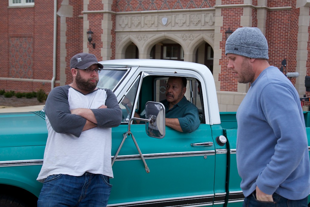 Jon and Andrew Erwin on set of Woodlawn with actor Lance Nichols.