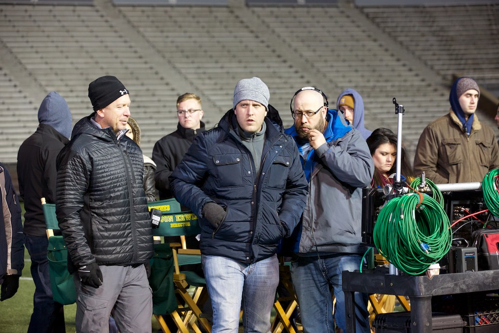 The brothers on the set of Woodlawn with football stunt coordinator Mark Ellis.