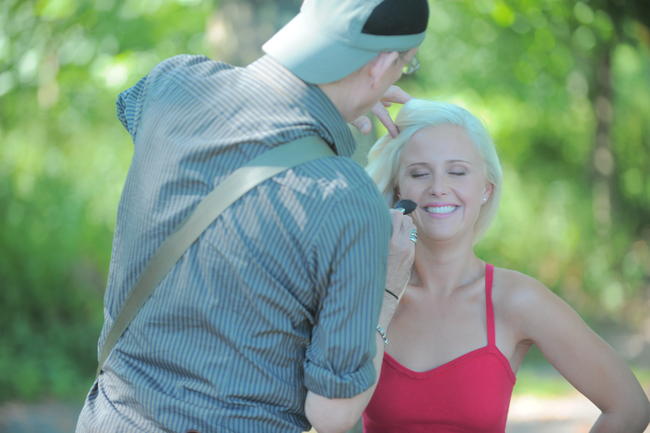 Dawn Sobolewski getting her blush fixed during a photoshoot