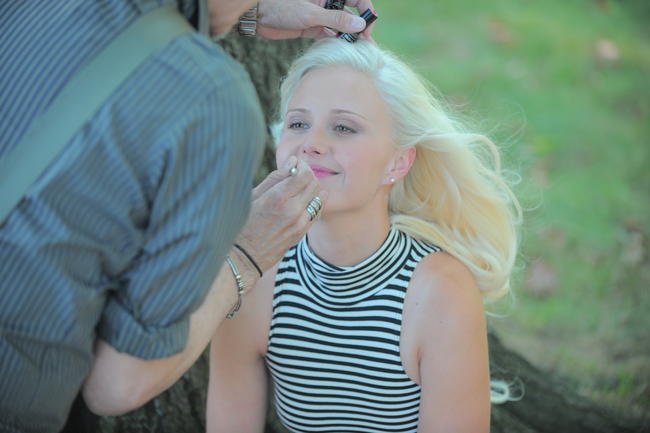 Dawn Sobolewski getting makeup applied during a photoshoot