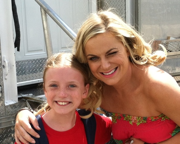 Christa Beth Campbell with Amy Poehler on the set of Sisters. She plays the younger version of Amy in the movie.