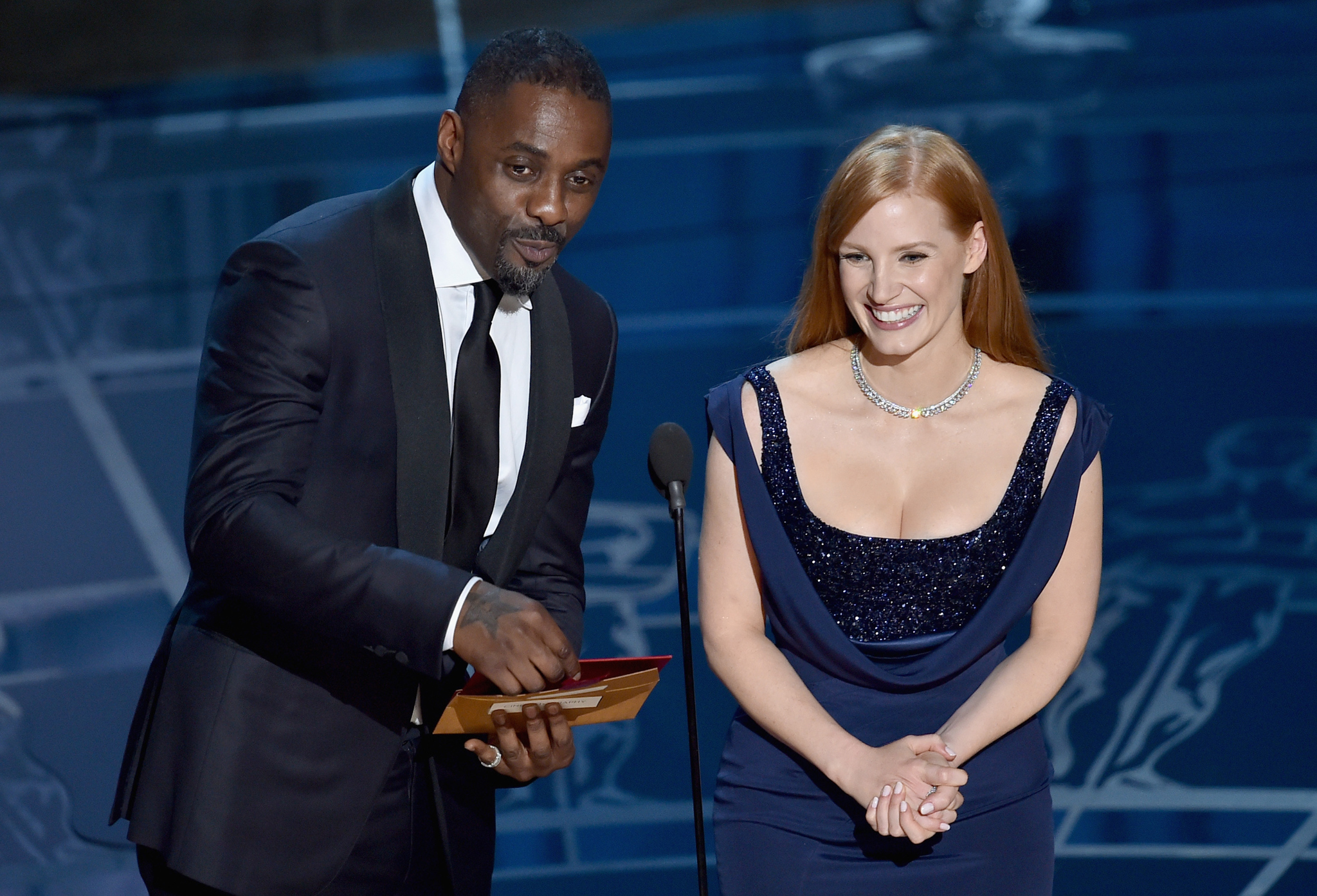 Idris Elba and Jessica Chastain at event of The Oscars (2015)