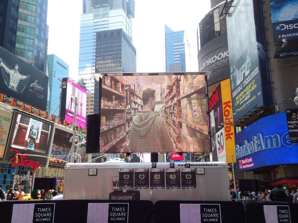 Lincoln Fenner (Director/ Producer/ Presenter) on screen in MORE 4 ME as it screens in New York's Times Square