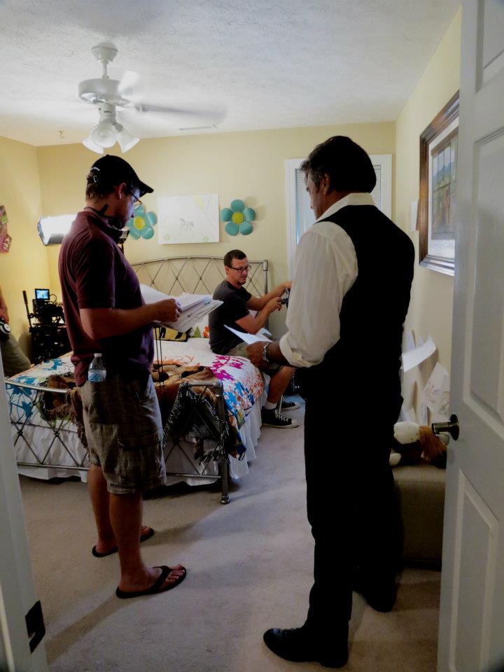 Director Justin Rossbacher (left) reviews script with Erik Estrada (right) on the set of Finding Faith.