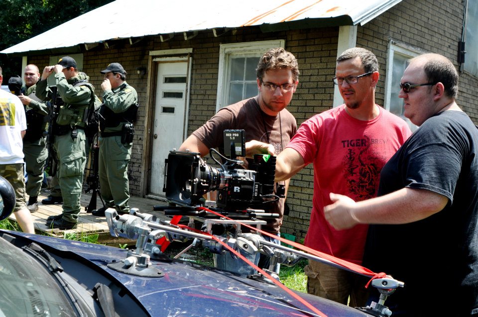 Reviewing playback on West Virginia State Police carmounted camera with DP Marc Hutchins and editor Won Novalis on the set of Finding Faith