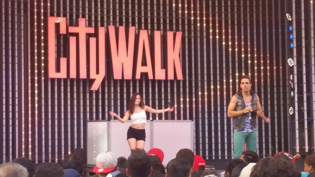 Catalina Tamayo dancing at CityWalk with Venezuelan singer 'Benavides'