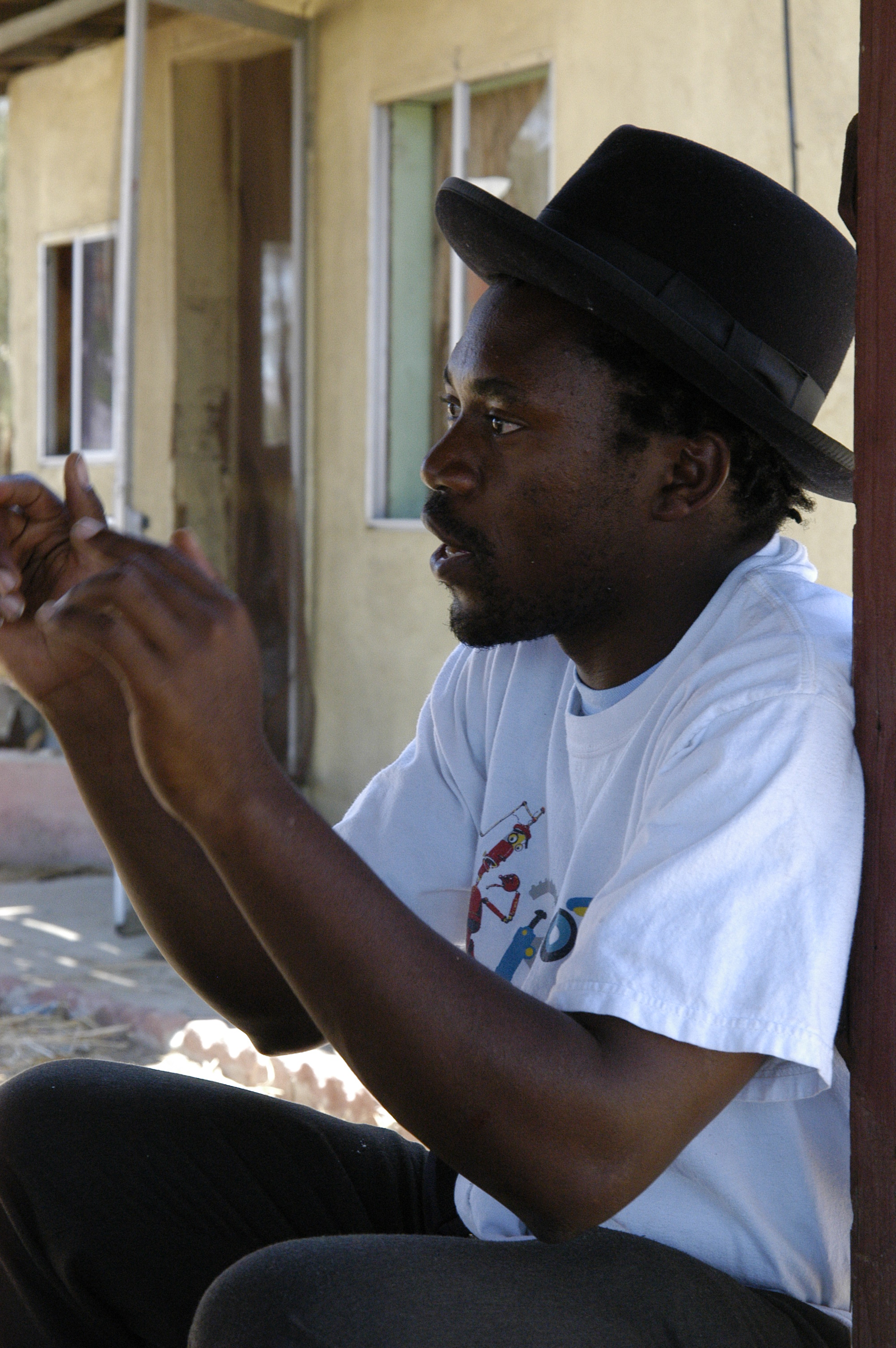 Dee Asaah discusses a scene with cast and crew of Blood Sun Town.