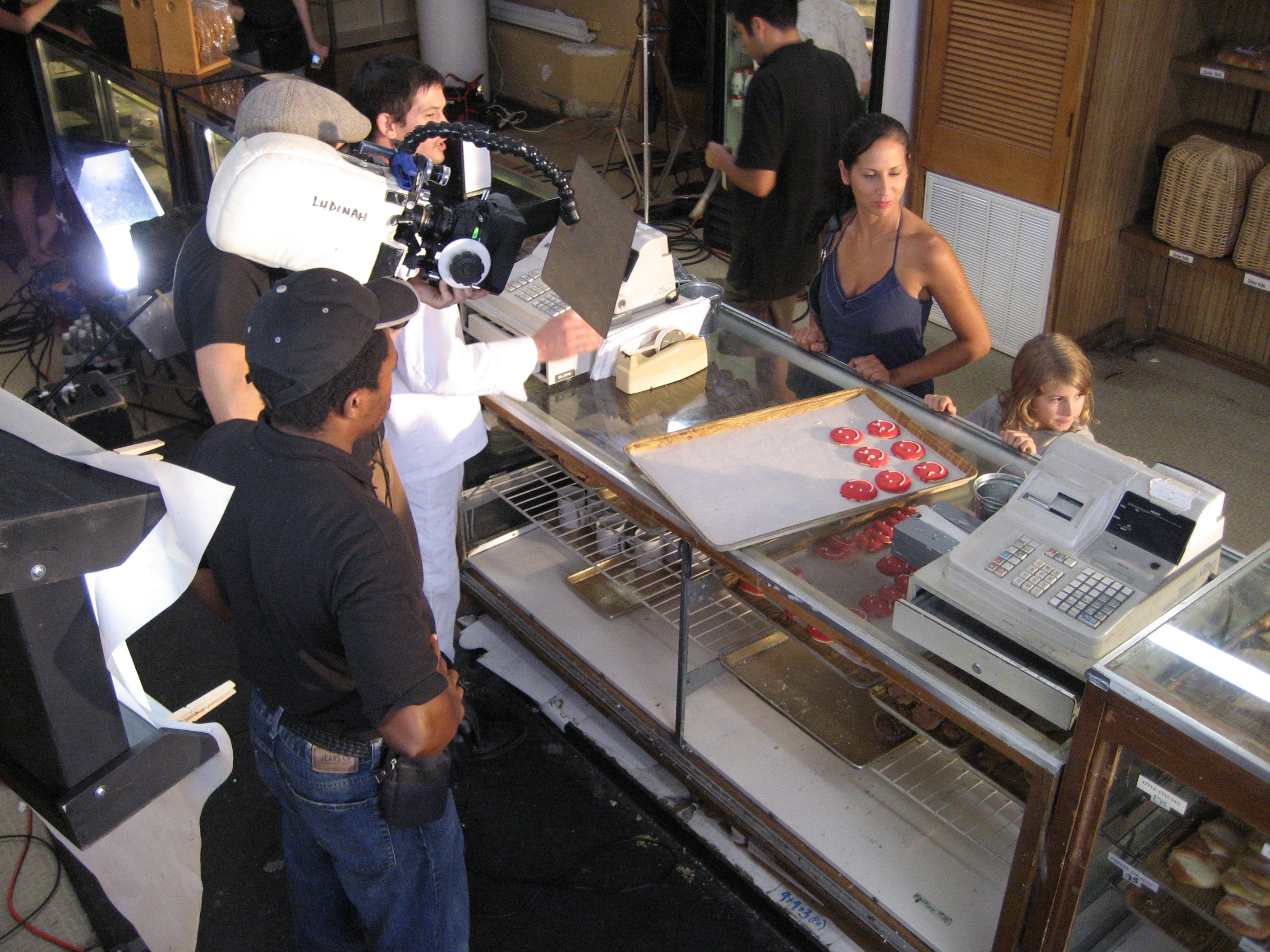 1st assistant cameraman Dee Asaah gets ready to pull focus on the set of Matt Bizer's A Bakery Story.