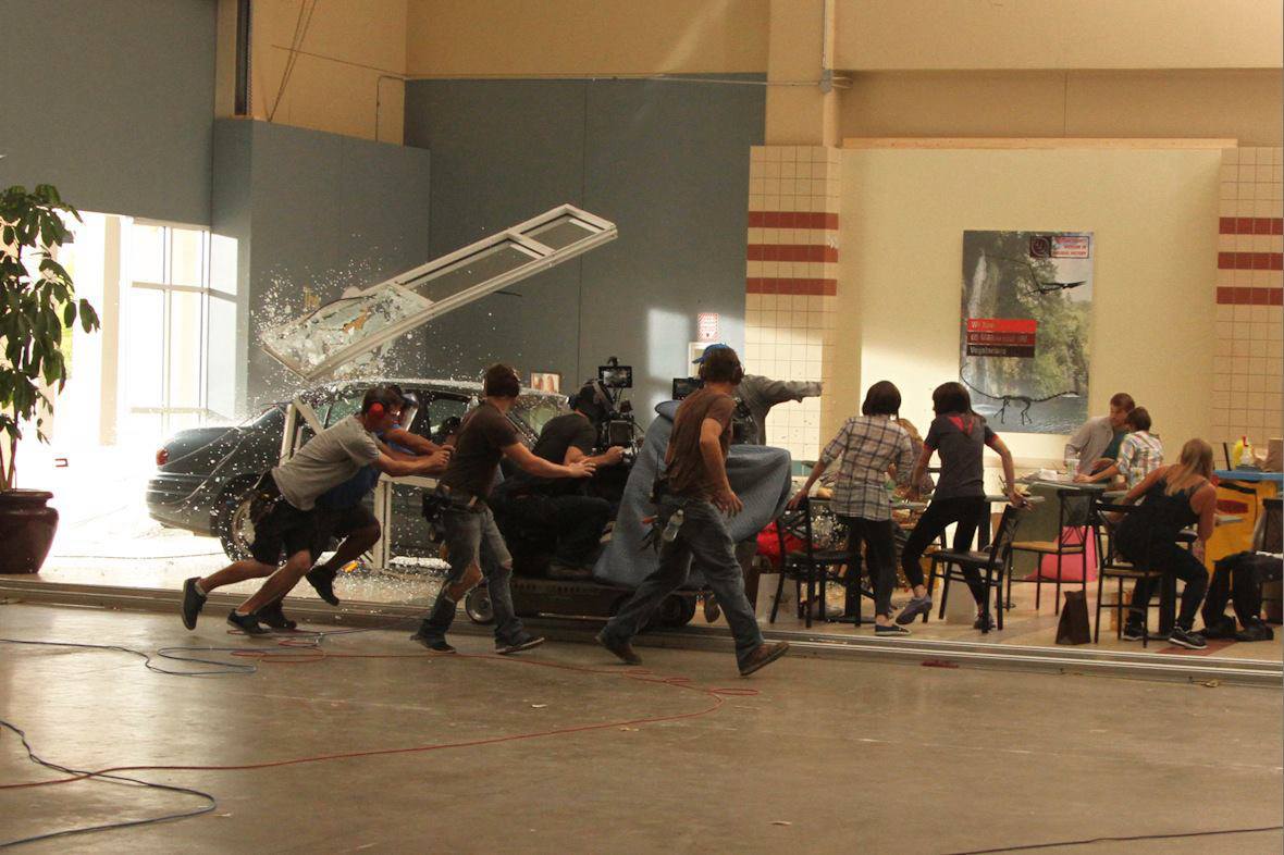 Teddy Smith (center on the dolly) operates a crash sequence on Left Behind.