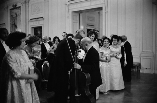 Pablo Casals whispering to John F. Kennedy on the night he performed at the White House (Jacqueline Kennedy on right)