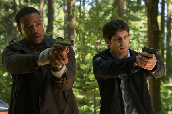 Still of Russell Hornsby and David Giuntoli in Grimm (2011)