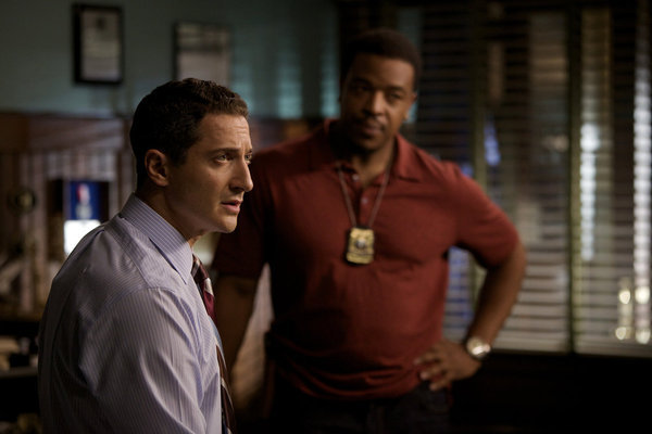 Still of Russell Hornsby and Sasha Roiz in Grimm (2011)