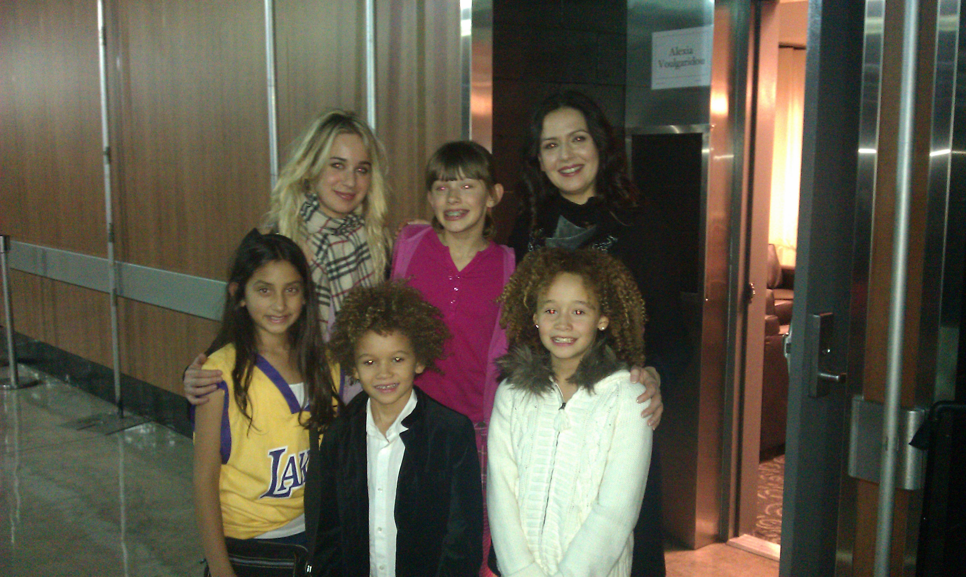 Armani backstage with his sister Talia and other performers at the Andrea Bocelli concert at the LA Staple Center.