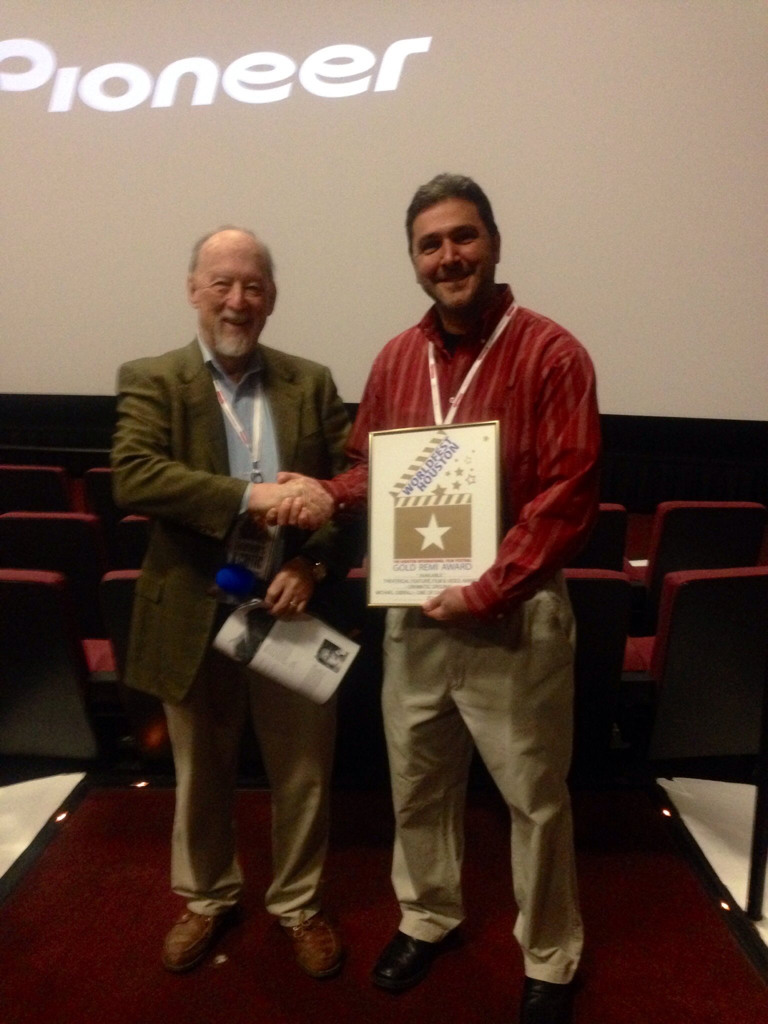 Hunter Todd, Founder of WorldFest Houston, awarding a Gold Remi Award to Michael Gibrall for the feature film 