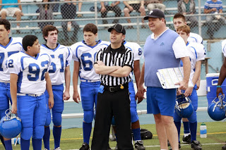 Zach Louis appearing on ABC's Modern Family. (number 60 behind ref)