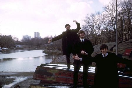 The Beatles ( Ringo Starr, John Lennon, Paul McCartney on top overturned boats)