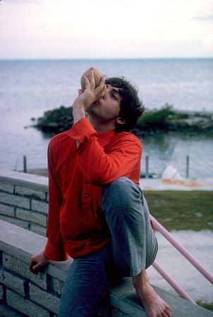 The Beatles ( Paul McCartney drinks the juice from a coconut), 1964