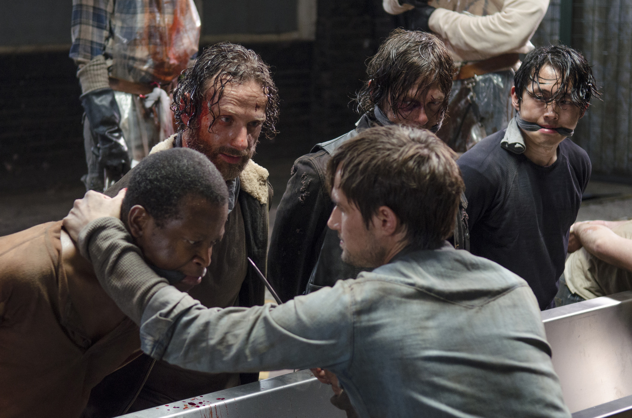 Still of Norman Reedus, Lawrence Gilliard Jr., Andrew Lincoln, Andrew J. West and Steven Yeun in Vaiksciojantys negyveliai (2010)