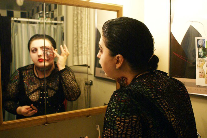 Cassandra Sechler, applying make-up, on the set of Belle Nouveau (2010)