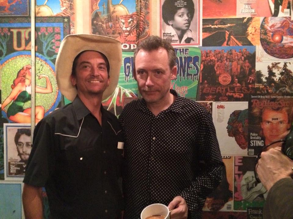 as Buddy Greenbloom, gothic cowboy with Jim Reid, lead singer of the Jesus and Mary Chain.