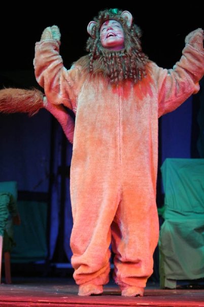 As Cowardly Lion in Wizard of Oz